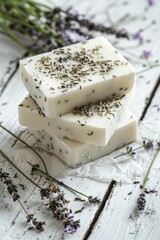 Poster - A stack of soap bars sitting on top of a table. Ideal for hygiene or bathroom concepts