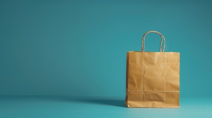 Poster - A simple brown paper bag placed on a blue surface. Ideal for packaging or recycling concepts