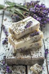 Poster - A stack of soap bars on a wooden table. Ideal for hygiene and bathroom concepts