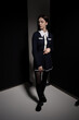 © Павел Костенко - Portrait of attractive caucasian young brunette woman in school uniform in studio. Elegant woman posing. Pretty stylish model. Beauty, Style, Fashion, Luxury