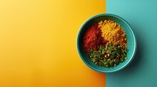 Three Colorful Spices In Bowl On Dual-toned Background
