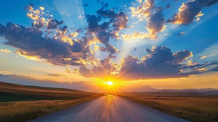 Wall Mural - Clouds over an empty road lit magnificently by rising sun