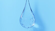 青色背景に気泡が入った水滴。3d。（横長）