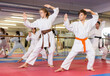 © JackF - Team of motivated teenagers are engaged in karate in the gym