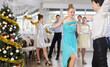 © JackF - Teenagers in holiday clothes dancing swing dance near the Christmas tree