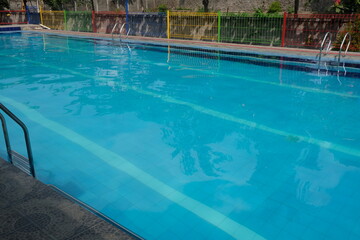 Crystal clear water on the blue swimming pool. This picture is suitable for background or wallpaper.