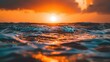 Wallpaper of a Sunset Over the Ocean During Golden Hour