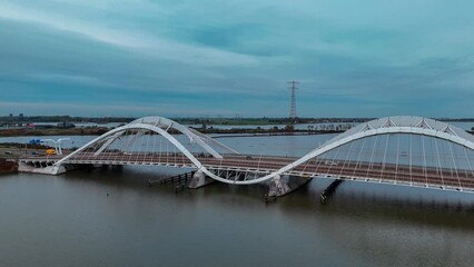 Wall Mural - Aerial drone view of modern Enneus Heerma Bridge Amsterdam Netherlands. High quality 4k footage