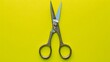 Scissors parting 'Impossible' against a lively lime background, symbolizing fresh starts