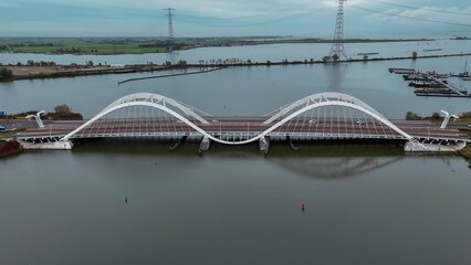 Wall Mural - Aerial drone view of modern Enneus Heerma Bridge Amsterdam Netherlands. High quality 4k footage