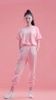 Young female pink t shirt and pants trendy fashion style
