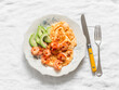 Delicious breakfast, brunch - omelette, shrimp, avocado on a light background, top view