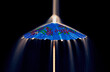 A cocktail umbrella under a waterfall of sugar