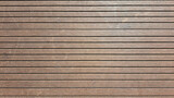 Fototapeta  - Brown grooved composite board - interesting background