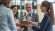 © kimly - Colleagues standing in a circle, passing around a trophy or plaque, taking turns admiring and celebrating their achievement