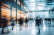 © MahmudulHassan - Blurred image of business people walking in the lobby of a modern office.