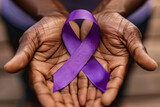 Fototapeta Konie - Close up of elderly black man's hands holding large purple Alzheimer disease awareness ribbon