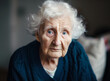 © artefacti - Expressive Portrait of an Elderly Woman with White Hair in Deep Thought