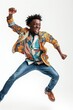 An African man in mid-air with a wide smile, celebrating happiness against a white background.