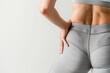 Stylish Fitness Apparel Highlighted by Woman Holding Her Hip