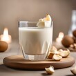 A glass of creamy macadamia nut milk with a splash of vanilla5