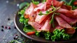 Thinly cut ham served on top of a bed of greens