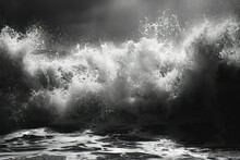 A Black And White Photo Of A Crashing Wave