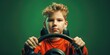 A young boy holding a steering wheel and looking at the camera. Suitable for educational and automotive concepts