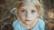 © Fotograf - Close-up portrait of a young girl with striking blue eyes. Ideal for children's marketing materials