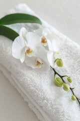 Poster - Close up of a towel with a delicate flower design. Perfect for spa or relaxation concepts