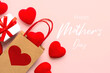 Happy Mother's Day. Top view of shopping bag with a red heart,little red hearts and the text Happy Mothers day