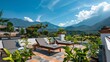 Beautiful balcony with sunbeds and plants with beautiful view of the mountains on the background and blue sky