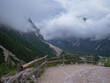 Gravel Path on a Road in the Italian Alps Mountains on a Cloudy Summer day, Italy