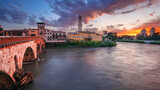 Fototapeta Miasto - Verona, Italy. Cityscape image of beautiful Italian town Verona with the Stone Bridge over Adige River at sunset.