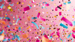 Colorful confetti falling on a pink background. Birthday party decoration in the style of celebration and happy holiday concept