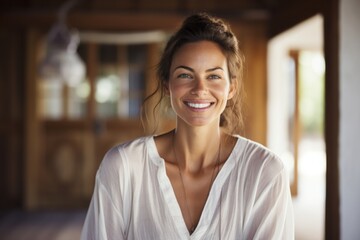 Wall Mural - Portrait of a grinning woman in her 40s wearing a simple cotton shirt on serene meditation room