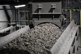 Fototapeta  - stones on rubber transport conveyor in cement plant