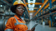 Portrait of a Professional Heavy Industry black female Engineer Wearing Safety Uniform and Hard Hat Uses Tablet Computer, Working in a Metal Manufacture Warehouse. Generative AI.