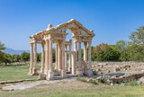 Fototapeta Zachód słońca - Tetrapylon Gate in Aphrodisias ancient city, Aydin, Turkey..