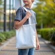 Tote bag mockup. Boy carrying reusable small white cotton linen eco organic fabric canvas blank totebag. AI generated