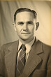 vintage photo middle aged man wearing suit 1940s black and white studio portrait