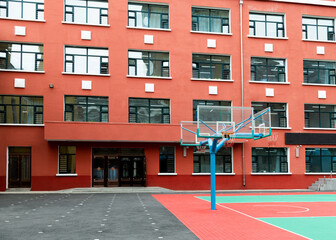 Canvas Print - A basketball court in front of the apartment