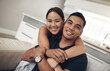© peopleimages.com - Portrait, smile and Asian couple in home to relax for love, care and hug on sofa in living room. Face, happy man and woman in lounge for connection, support or commitment for healthy relationship