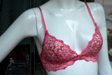 Fototapeta Sypialnia - Closeup of pink bra on mannequin in a fashion store showroom