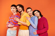 © Bliss - four modish appealing cheerful gay men in vibrant clothes posing together actively, pride month