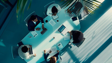 Poster - Top view of group of multiethnic busy people working in an office Aerial view with businessman and businesswoman sitting around a conference table with blank copy space Business meetin : Generative AI