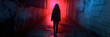 A woman in a hoodie is standing in front of red light