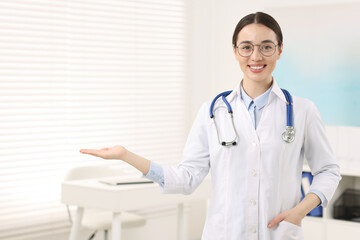 Sticker - Medical consultant with glasses and stethoscope in clinic, space for text