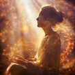 Golden healing light healing meditation - female sitting with eyes closed basking in sunlight sending beautiful healing intention across the ether with copy space for spiritual message
