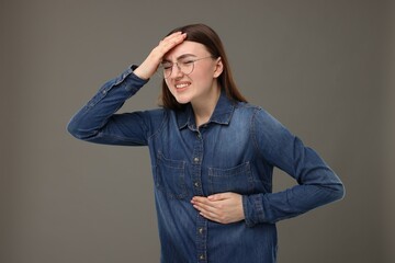 Sticker - Woman having heart attack on grey background